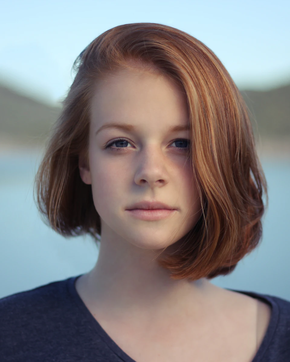 Front-facing portrait of a woman with red hair